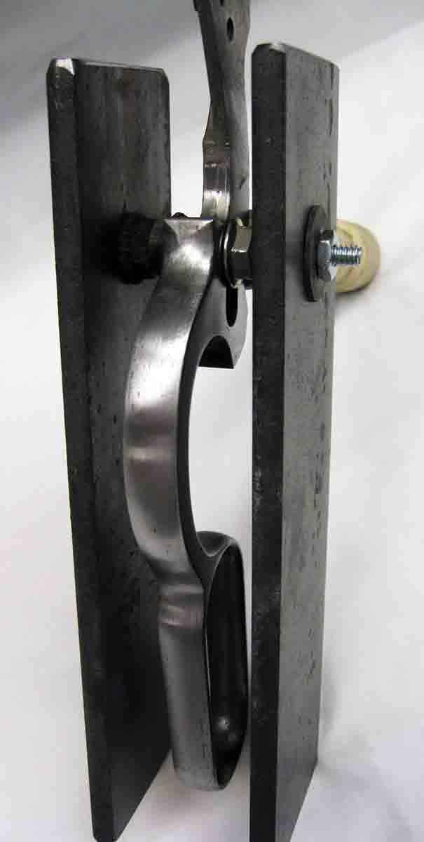 This is how a rifle lever is blocked during the pack-hardening process.